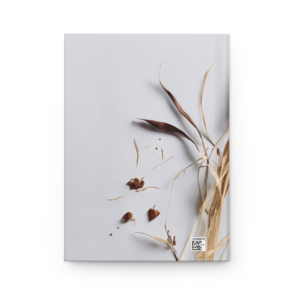 Notebook cover with dried plants on a light gray background