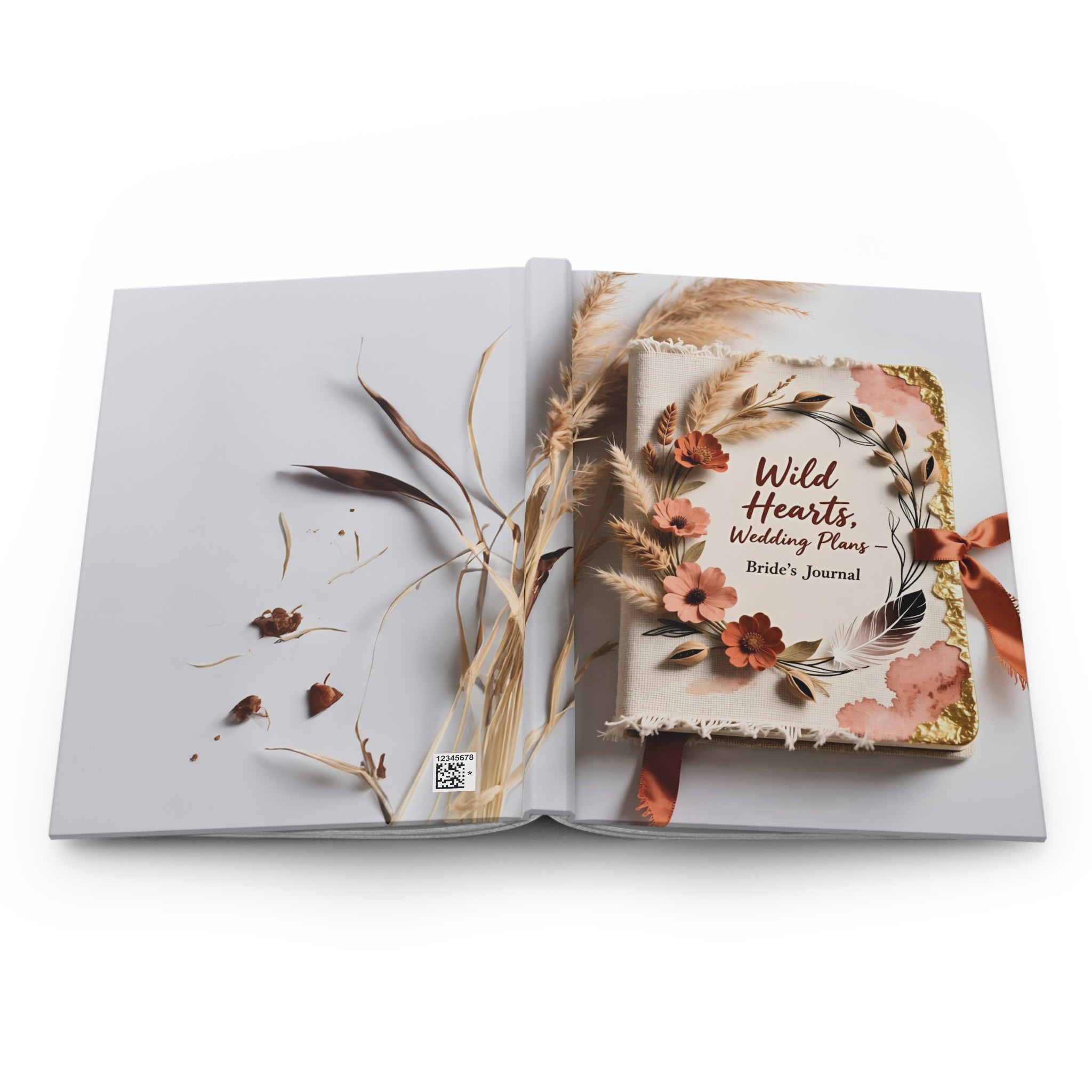 Open book with floral and feather design on a white background