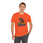Man wearing an orange t-shirt with a dog graphic and text on a white background