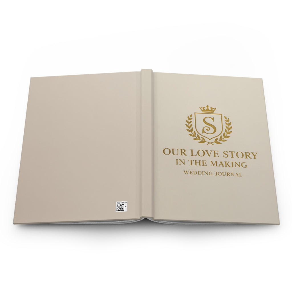 Open wedding journal with gold text and logo on beige pages