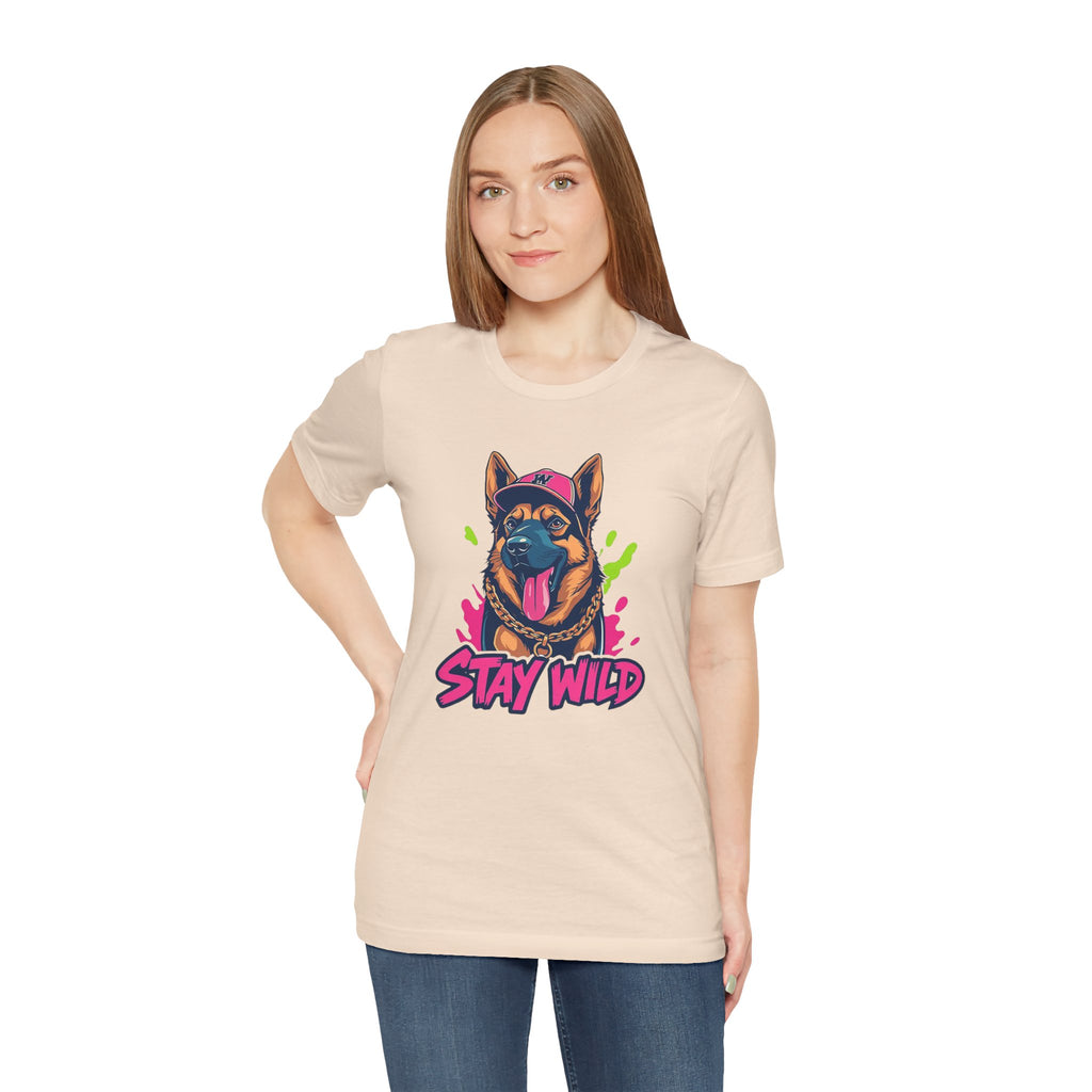 Woman wearing a beige t-shirt with a dog graphic and 'Stay Wild' text on a white background