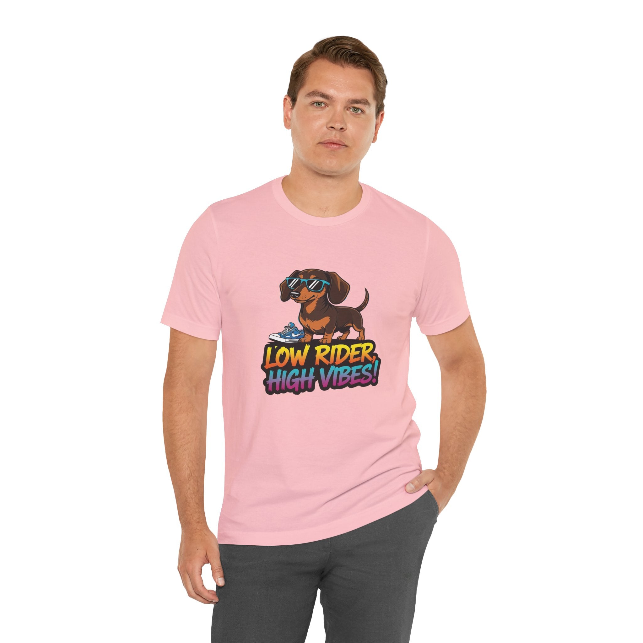 Man wearing a pink t-shirt with a dachshund graphic and text on a white background