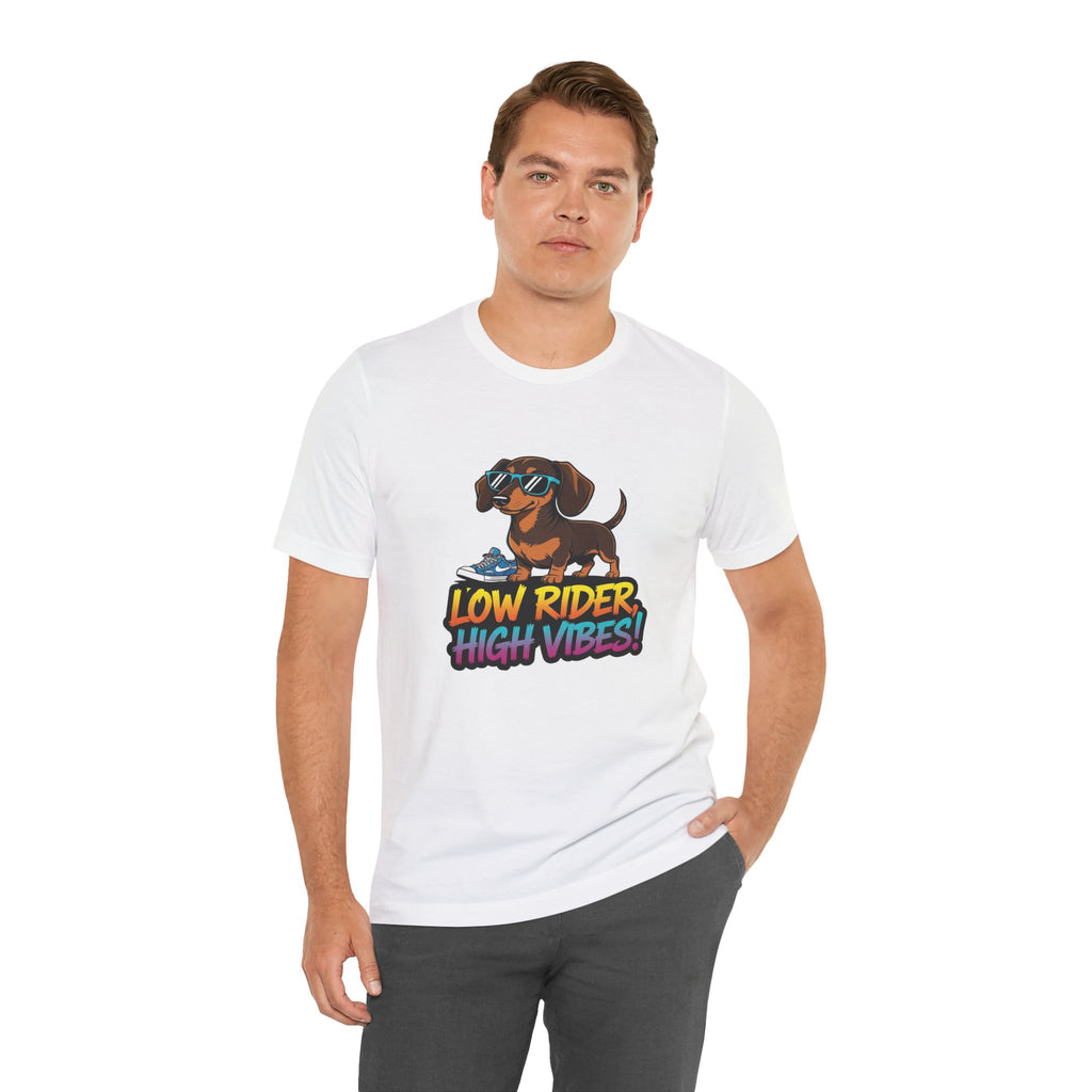 Man wearing a white t-shirt with a graphic design of a dachshund and text 'Low Rider High Vibes' on a white background.