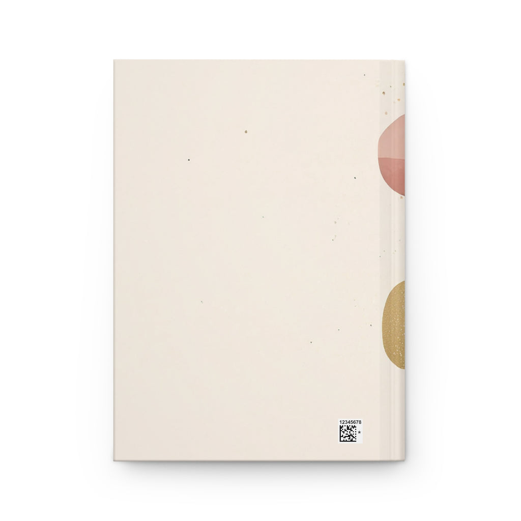 Beige notebook with abstract circular designs on a white background