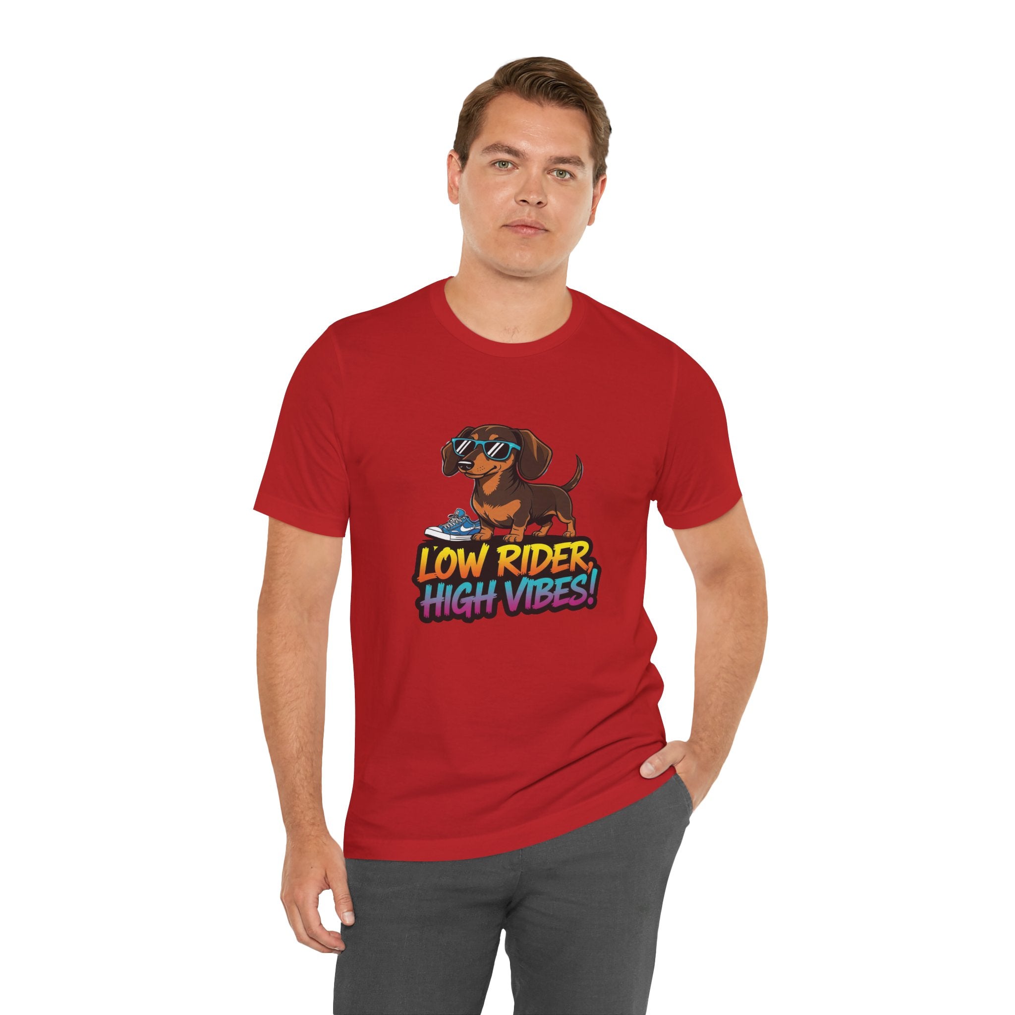 Man wearing a red t-shirt with a dog graphic and text 'Low Rider High Vibes' on a white background
