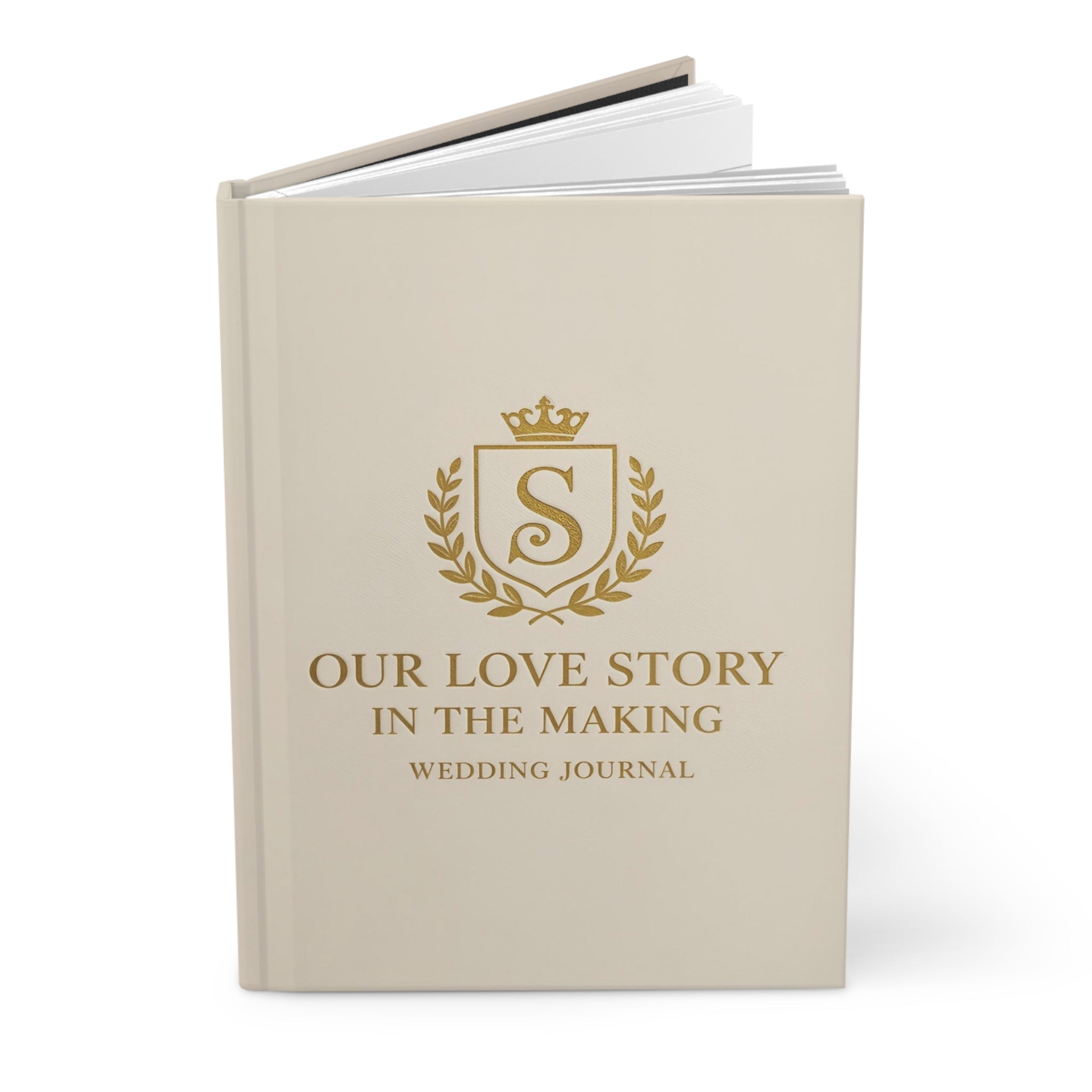 Beige wedding journal with gold text and emblem on a white background